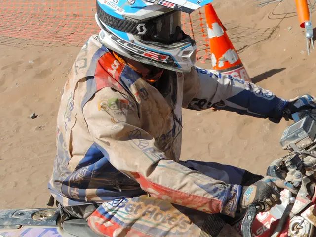 In the foreground of the image, there is a man wearing coat and helmet is sitting on a motor bike....