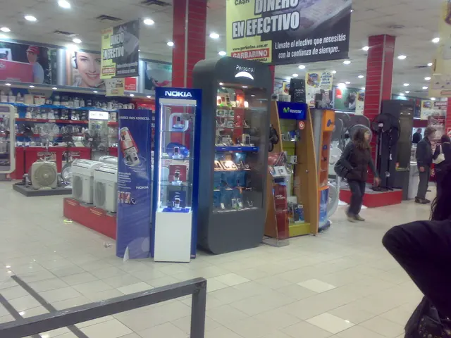 This image is taken inside a store, there are mobile phones, coolers, fans and some other...