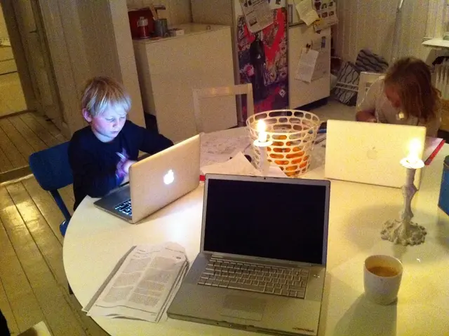 This is a picture in a home the two children are studying. This is a study table there are three...