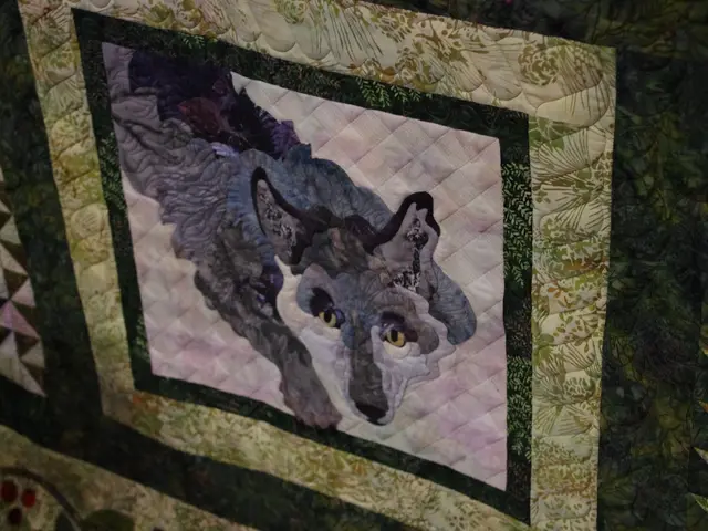 In this image there is a design of an animal on the cloth.