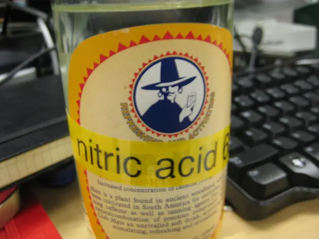 In this image there is a bottle with a liquid in it and a label to it , and there is a keyboard and...